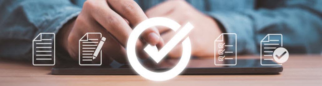 man writing notes on ipad